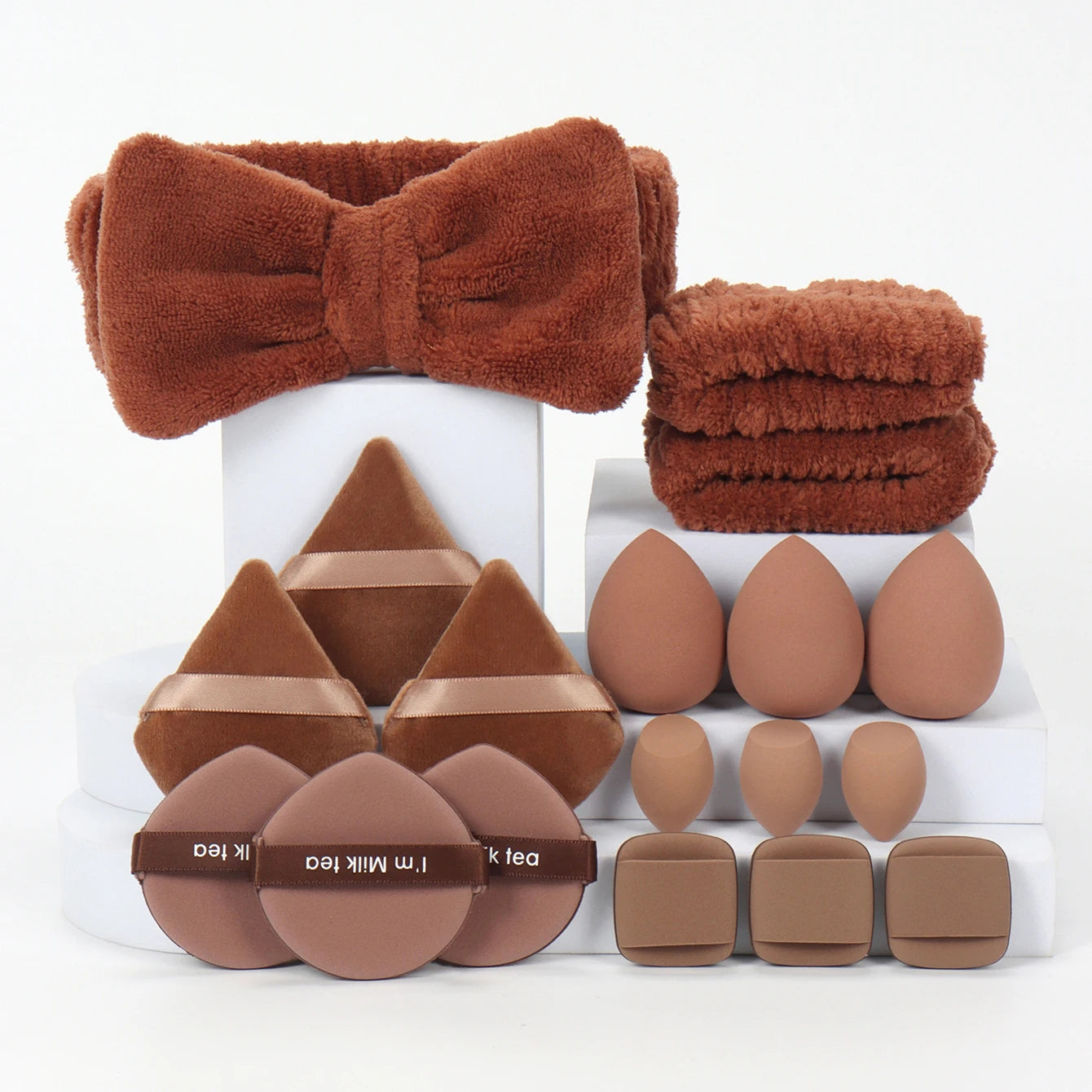 18 piece headband set. 1 hair band & 2 wrist bands & 3 make-up Sponges & 3 Mini Square Air Cushions & 3 triangular powder puff & Beauty World Shop