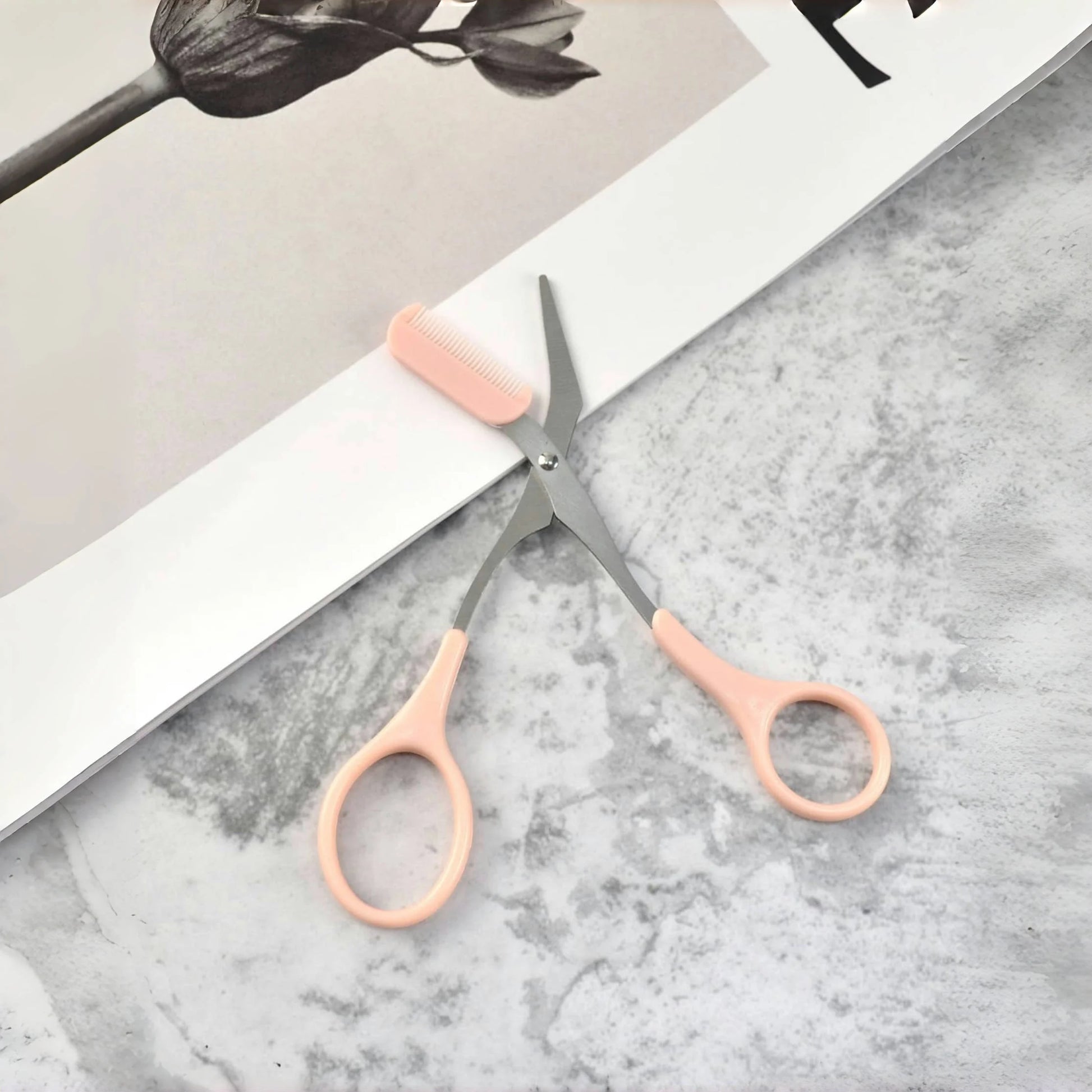 Pink eyebrow trimming scissors with built-in comb - stainless steel, precise grooming tool, creating perfect eyebrows Beauty World Shop