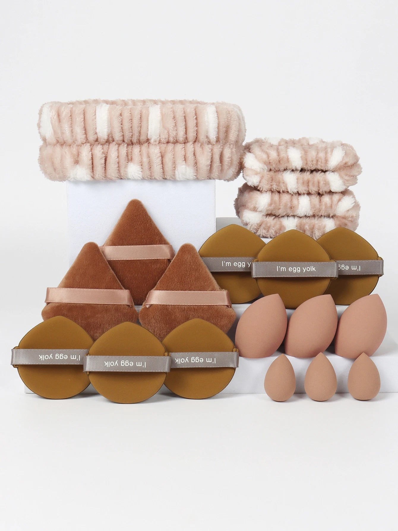 18 piece headband set. 1 hair band & 2 wrist bands & 3 make-up Sponges & 3 Mini Square Air Cushions & 3 triangular powder puff & Beauty World Shop