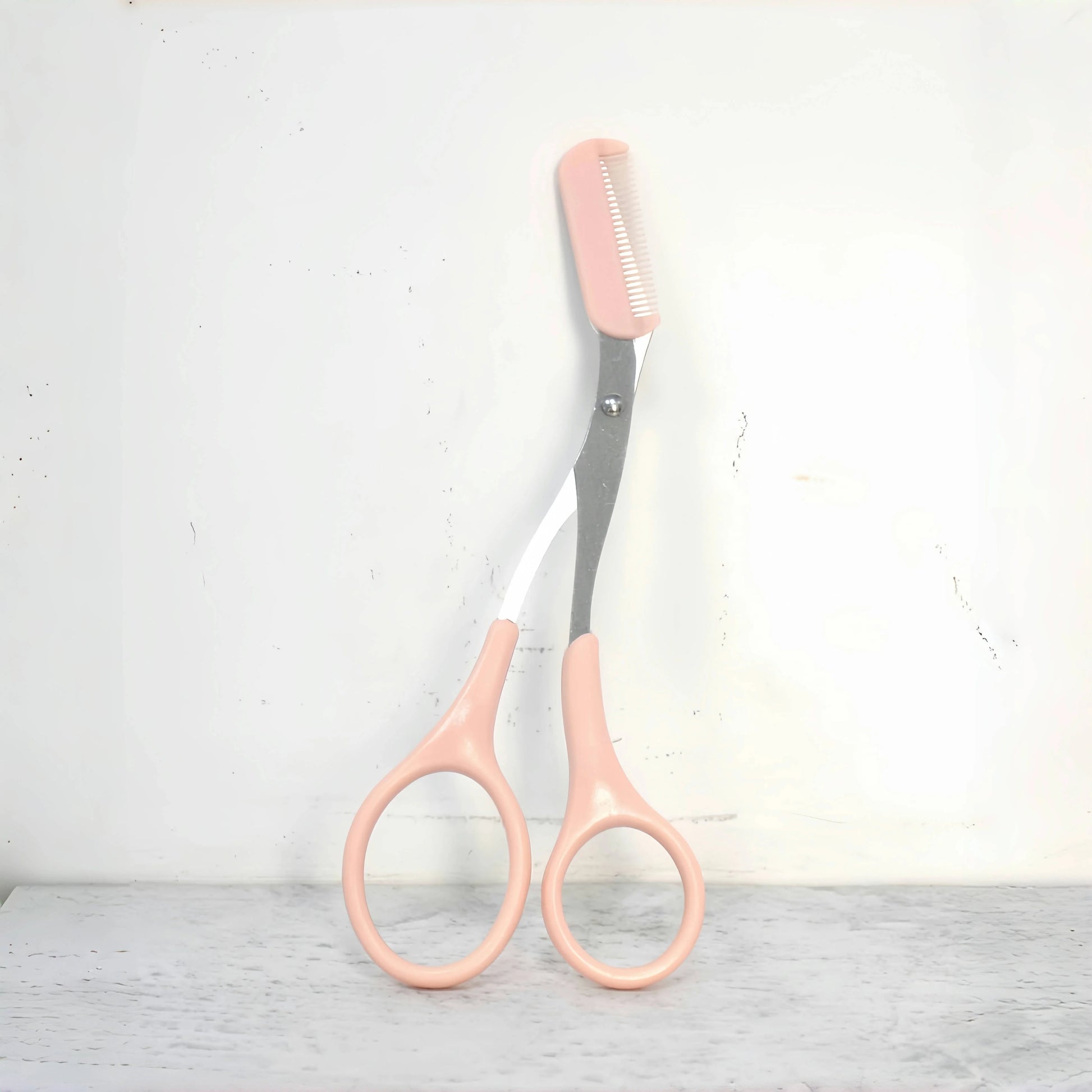 Pink eyebrow trimming scissors with built-in comb - stainless steel, precise grooming tool, creating perfect eyebrows Beauty World Shop