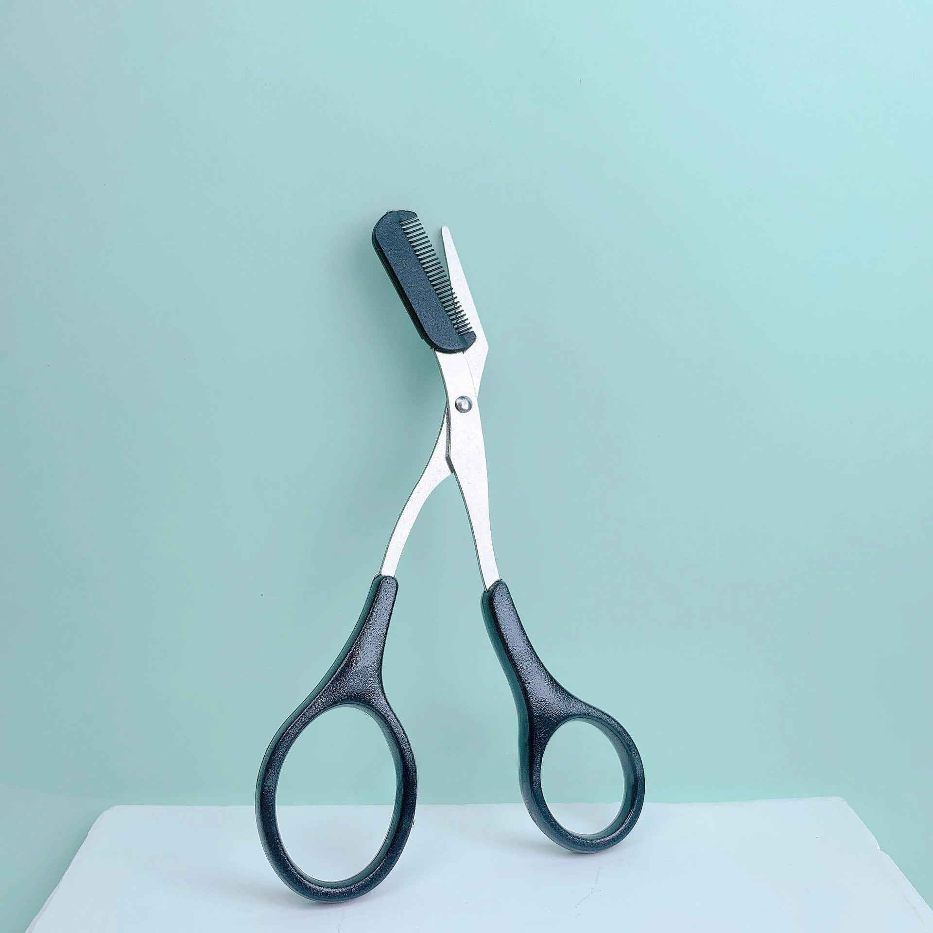 Pink eyebrow trimming scissors with built-in comb - stainless steel, precise grooming tool, creating perfect eyebrows Beauty World Shop
