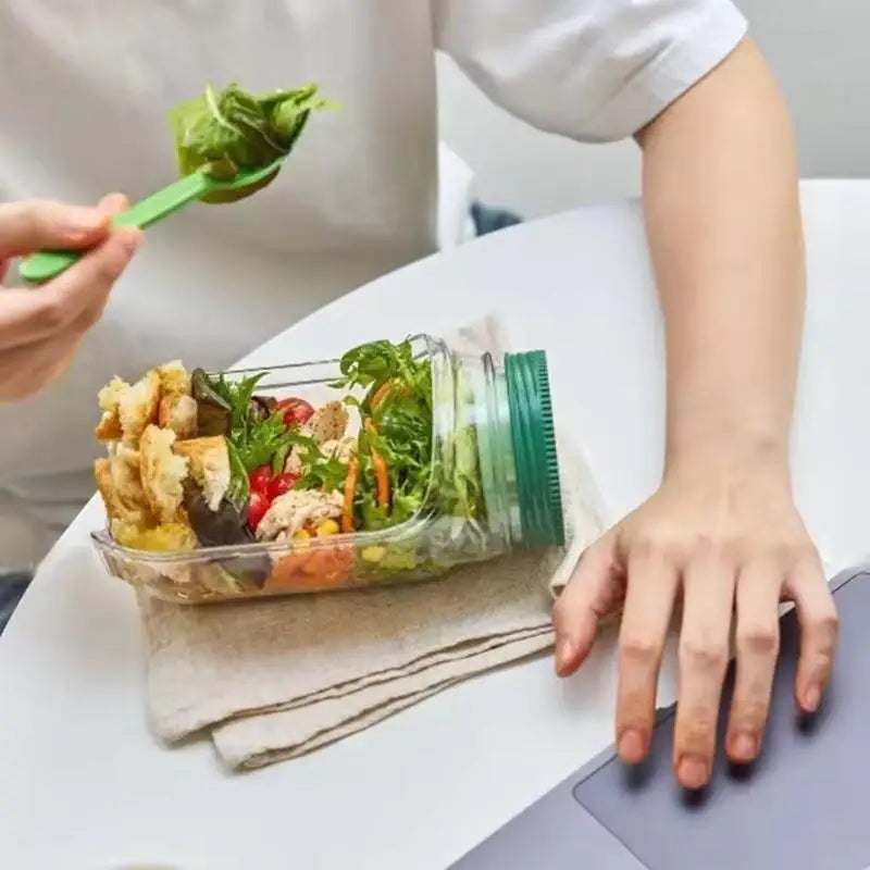 This Original Salad Pod is a portable salad container with a side-opening lid, perfect for home use and outdoor activities. Beauty World Shop