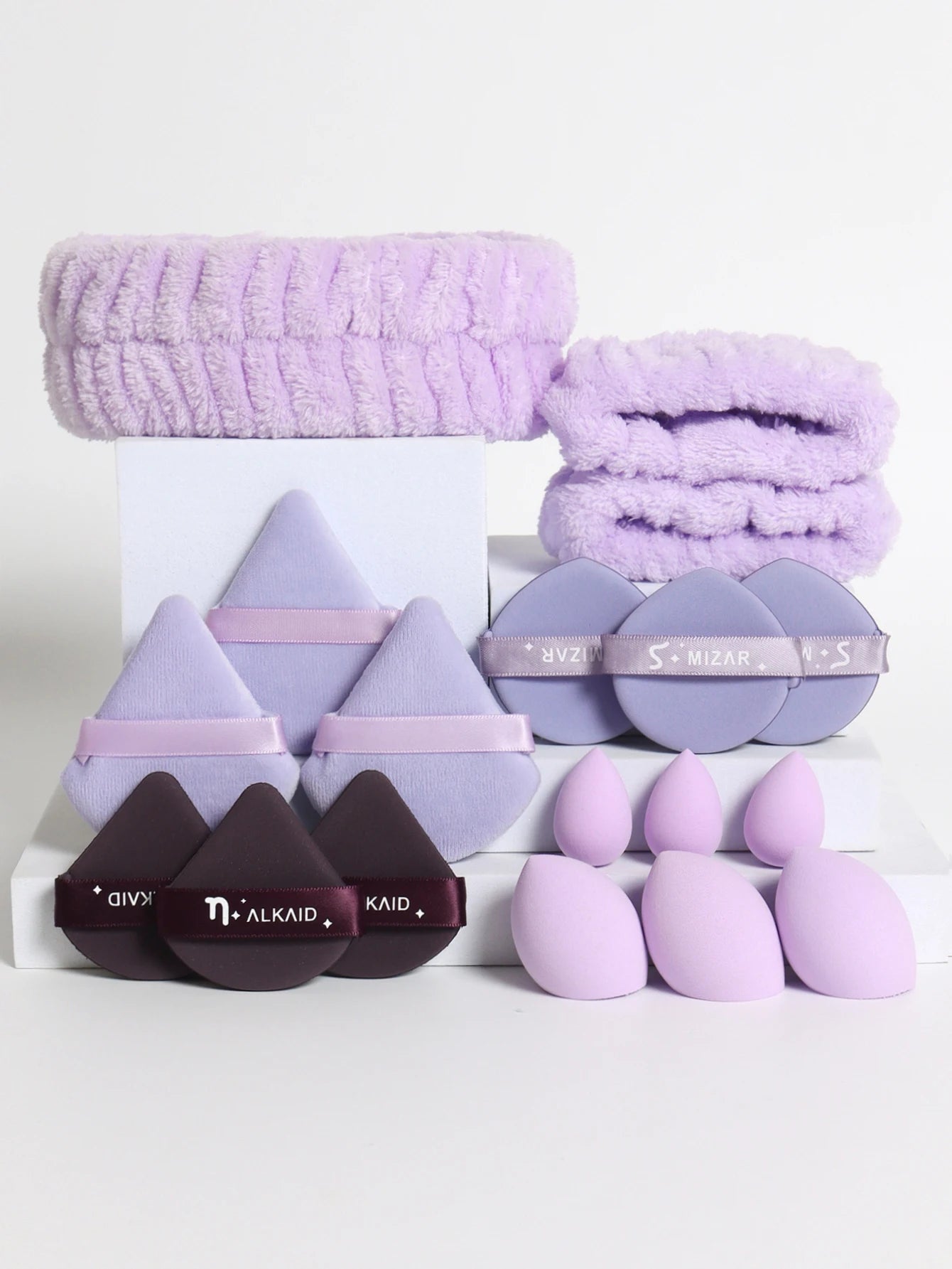 18 piece headband set. 1 hair band & 2 wrist bands & 3 make-up Sponges & 3 Mini Square Air Cushions & 3 triangular powder puff & Beauty World Shop