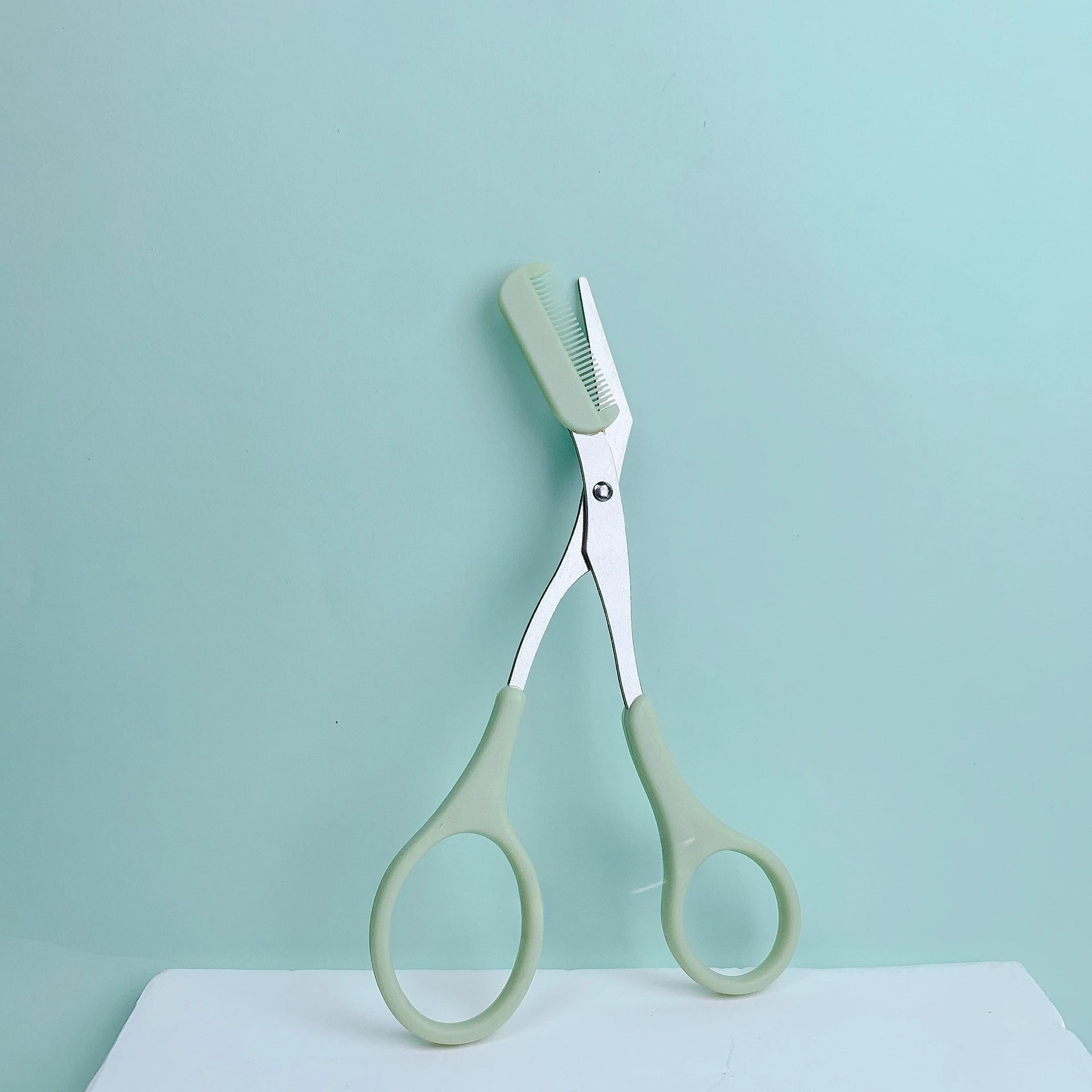 Pink eyebrow trimming scissors with built-in comb - stainless steel, precise grooming tool, creating perfect eyebrows Beauty World Shop