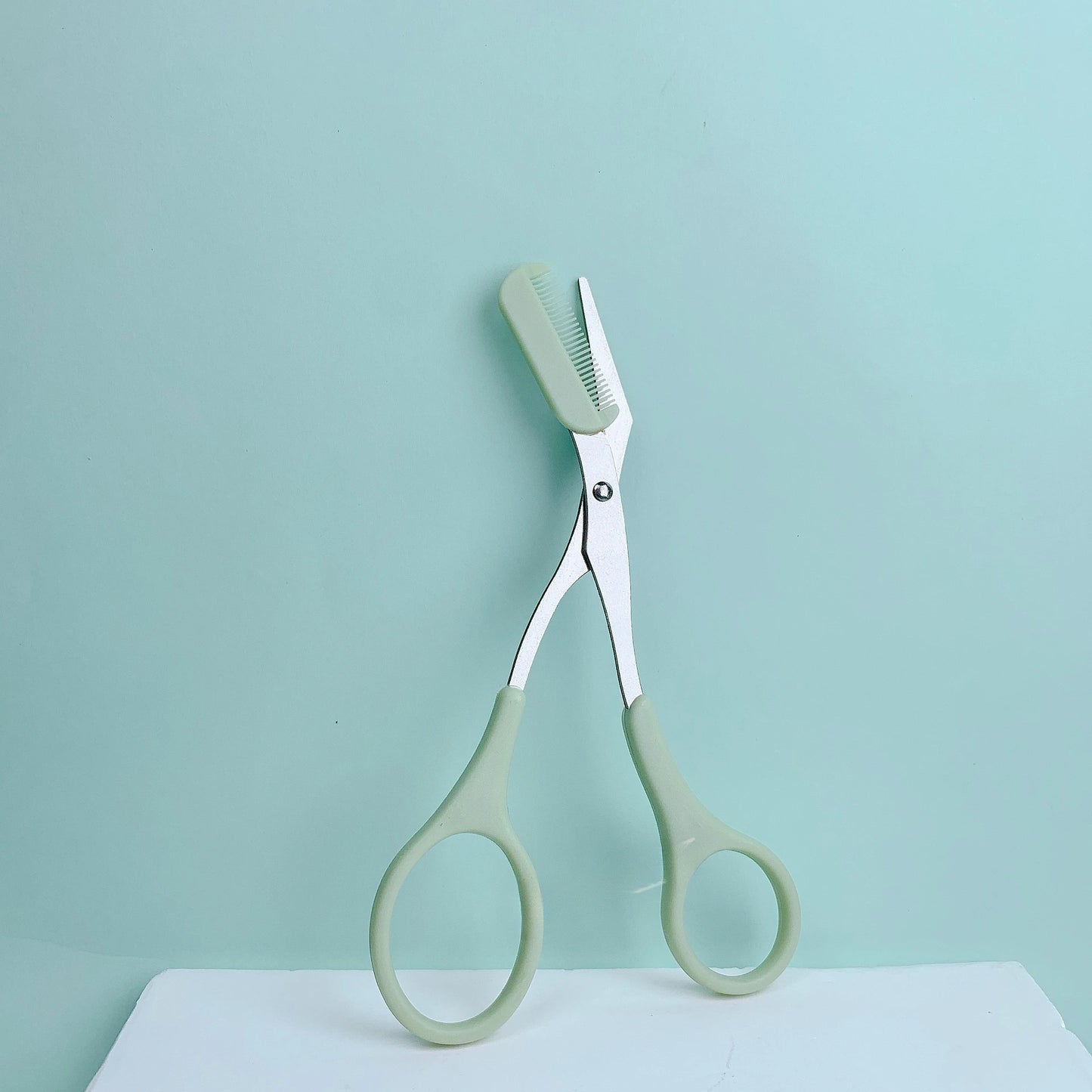Pink eyebrow trimming scissors with built-in comb - stainless steel, precise grooming tool, creating perfect eyebrows Beauty World Shop