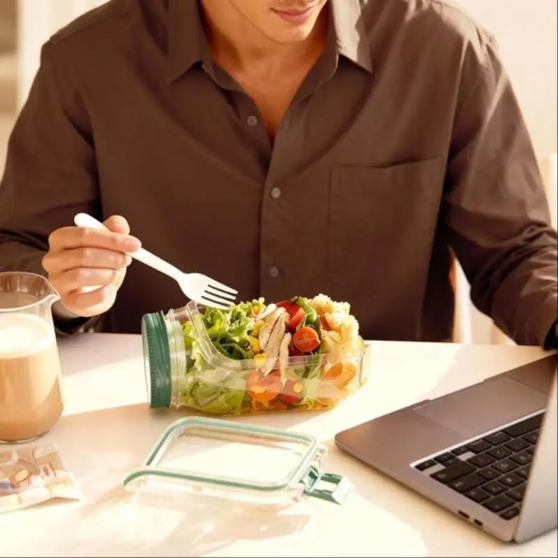 This Original Salad Pod is a portable salad container with a side-opening lid, perfect for home use and outdoor activities. Beauty World Shop