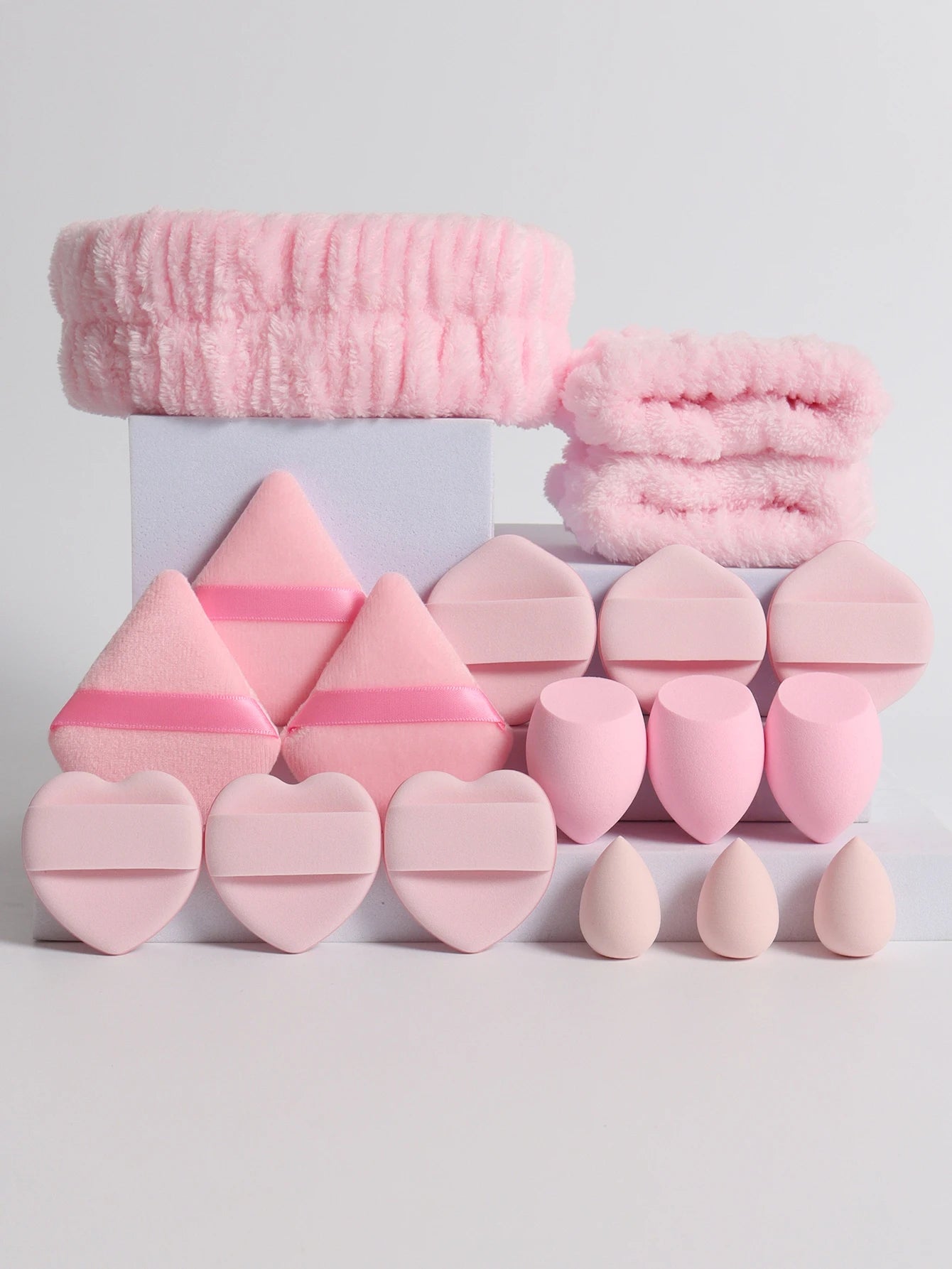 18 piece headband set. 1 hair band & 2 wrist bands & 3 make-up Sponges & 3 Mini Square Air Cushions & 3 triangular powder puff & Beauty World Shop